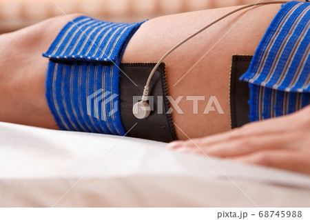High Angle View Of A Woman With Electrodes On Her Stomach High Angle View Of A Woman With Electrodes On Her Stomach 68745988
