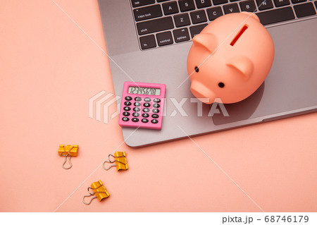 Business and finance desk workspace with high tech touchscreen laptop and pink theme accessories Business and finance desk workspace with high tech touchscreen laptop and pink theme accessories 68746179