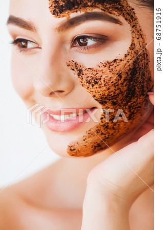 Face Skincare. Young Charming Girl Makes a Black Charcoal Mask on Her Face 68751916