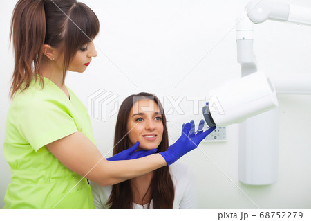 Close up portrait of attractive woman sitting in dentist office Close up portrait of attractive woman sitting in dentist office 68752279