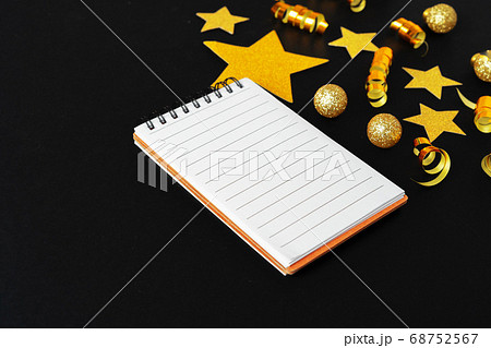 Blank sheet of paper with golden decorative stars. New year resolutions concept 68752567