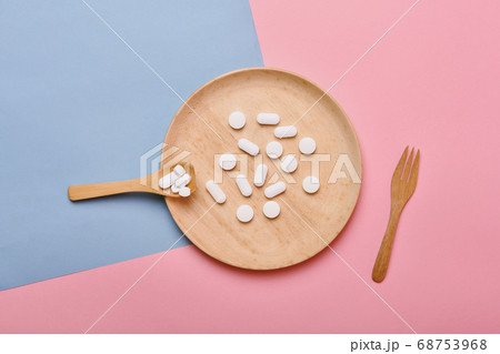 Assorted pharmaceutical medicine, Taking too much medication pills on spoon, Overdiagnosis drugs Assorted pharmaceutical medicine, Taking too much medication pills on spoon, Overdiagnosis drugs 68753968