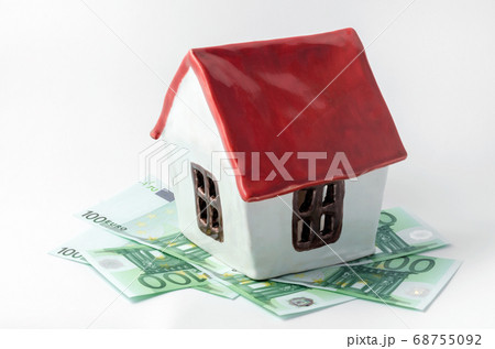 small white porcelain house with a red roof and money euro banknotes rent purchase realtor small white porcelain house with a red roof and money euro banknotes rent purchase realtor 68755092