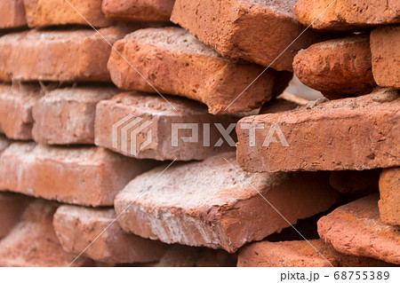 hole in an old brick wall collapsing 68755389