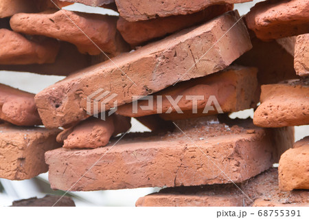 hole in an old brick wall collapsing 68755391