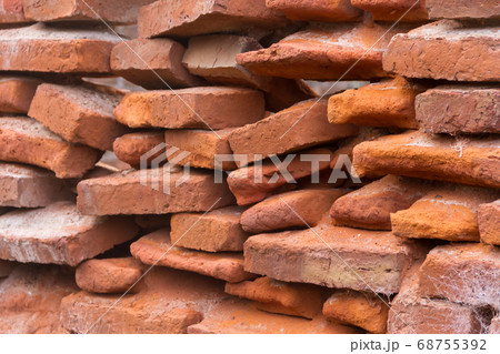hole in an old brick wall collapsing 68755392