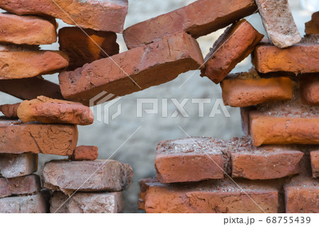 hole in the old bricks wall crumbling hole in the old bricks wall crumbling 68755439