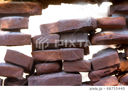 hole in the old bricks wall crumbling hole in the old bricks wall crumbling 68755440
