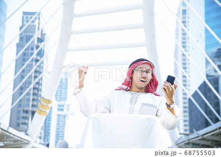 Islamic man using smartphones app organize 68755503