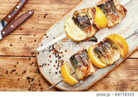 Grilled fish on skewers. 68756505