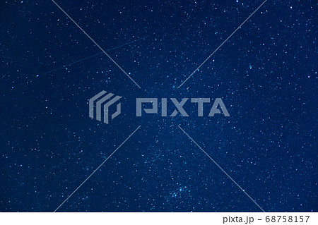 Starry sky at night with falling star. Astrophotography background Starry sky at night with falling star. Astrophotography background 68758157