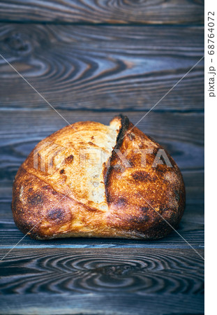 Homemade tartine bread on dark wooden table 68764072