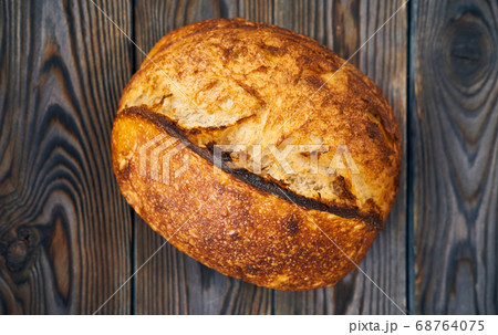 Homemade tartine bread on dark wooden table 68764075