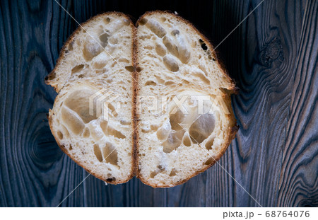 Homemade tartine bread on dark wooden table 68764076