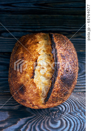 Homemade tartine bread on dark wooden table 68764077
