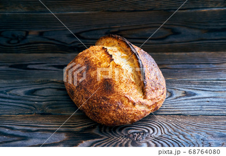 Homemade tartine bread on dark wooden table 68764080