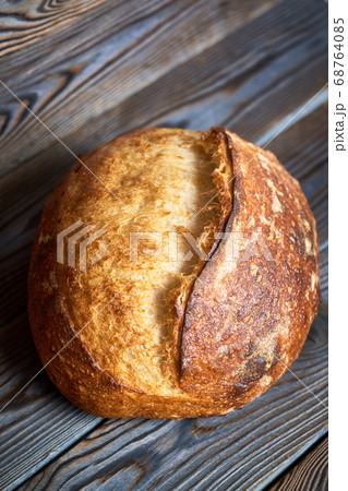 Homemade tartine bread on dark wooden table 68764085