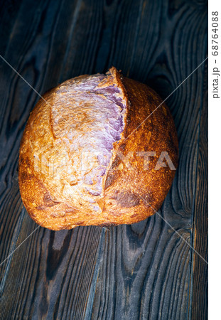 Homemade tartine bread on dark wooden table 68764088