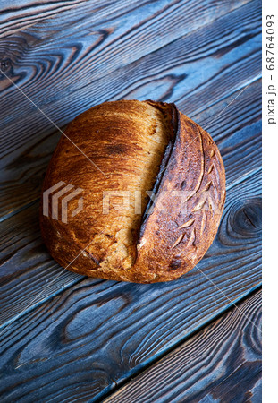 Homemade tartine bread on dark wooden table 68764093