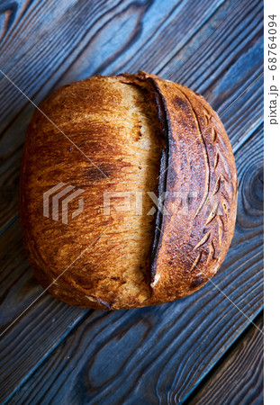 Homemade tartine bread on dark wooden table 68764094