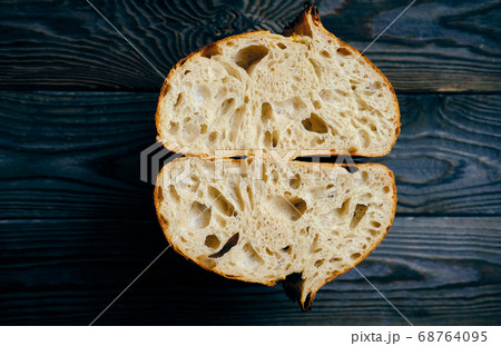 Homemade tartine bread on dark wooden table 68764095