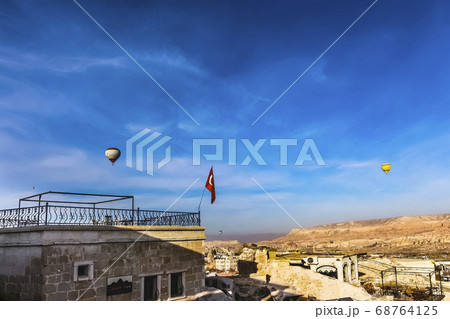 Two hot air balloons flying over Cappadicia Two hot air balloons flying over Cappadicia 68764125