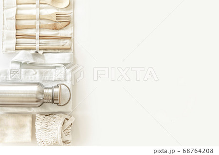 Eco friendly accessories - bamboo cutlery, eco bags, reusable water bottle. Eco friendly accessories - bamboo cutlery, eco bags, reusable water bottle. 68764208