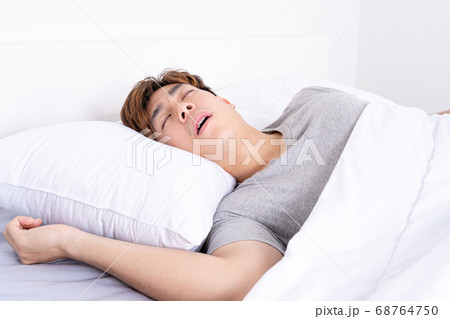 Man snoring loudly because of tired from work, 68764750