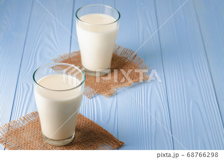 Glass of milk on table close up Glass of milk on table close up 68766298