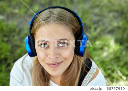Pretty young white woman in public park. Pretty young white woman in public park. 68767950