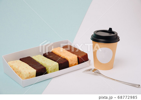 Set of cakes in icing and chocolate on a light Set of cakes in icing and chocolate on a light 68772985