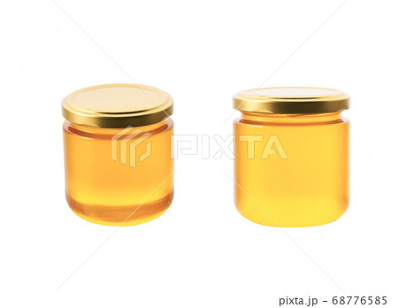 jar of organic honey isolated on white background. jar of organic honey isolated on white background. 68776585