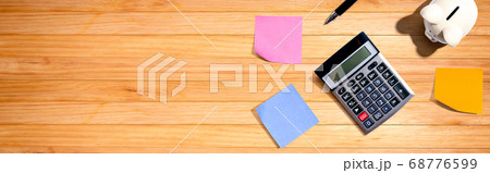 Calculator with a piggy bank 68776599