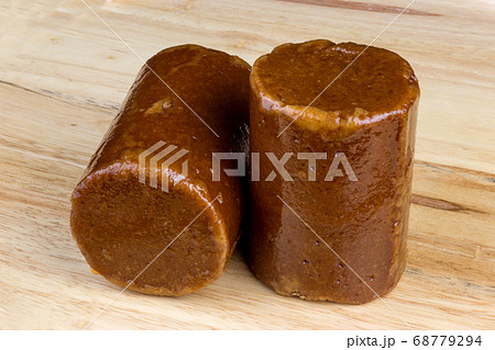 Palm Sugar or Gula Melaka on a Wooden Surface Palm Sugar or Gula Melaka on a Wooden Surface 68779294