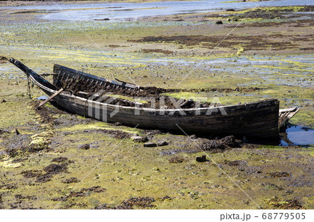 Old Wrecked Boat on a Coastal Beach Old Wrecked Boat on a Coastal Beach 68779505