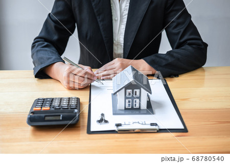 Real estate agent working sign agreement document 68780540