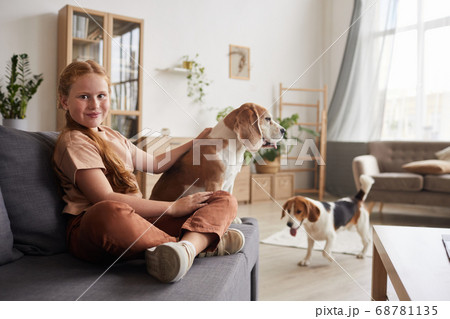 Cute Girl Playing with Dogs at Home 68781135