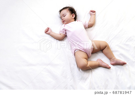 Little baby girl 12 months wearing pink cloth 68781947