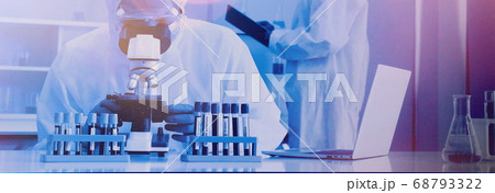 doctors working in virus lab. doctor using microscope check for viruses in laboratory doctors working in virus lab. doctor using microscope check for viruses in laboratory 68793322