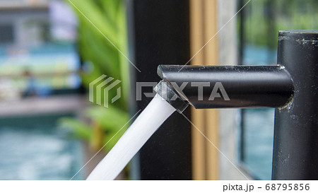 Jet streams of water running from a modern black Jet streams of water running from a modern black 68795856