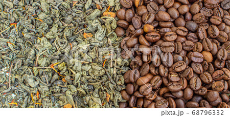 Dry green tea leaves and roasted coffee beans. 68796332