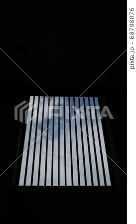 The sky seen through the room with the bars. The sky seen through the room with the bars. 68798076