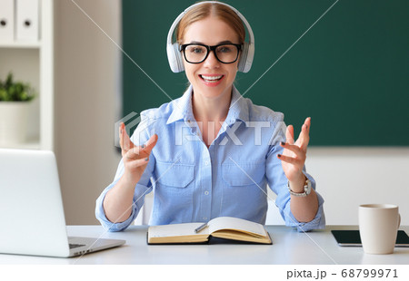 Smart teacher talking to camera. Smart teacher talking to camera. 68799971