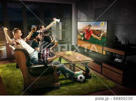 Group of friends watching tennis match, sport together Group of friends watching tennis match, sport together 68800230