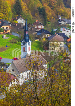 Church in Slovenian village, autumn trees Church in Slovenian village, autumn trees 68800999