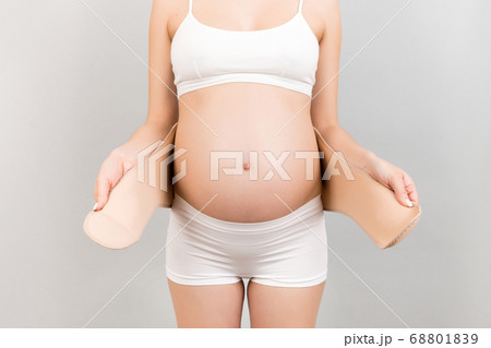 Close up of pregnant woman in white underwear 68801839