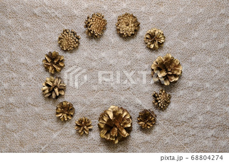 A background of gilded pine cones, top view, a A background of gilded pine cones, top view, a 68804274