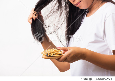 Woman weak hair her hold hairbrush with damaged 68805254