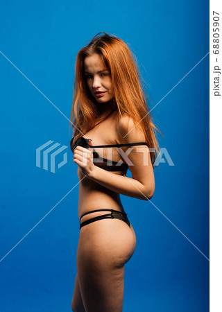 Glamorous curvy red head woman with a sexy body Glamorous curvy red head woman with a sexy body 68805907