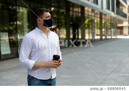 Businessman near office in protective cloth face Businessman near office in protective cloth face 68806043